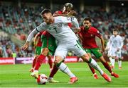 1 September 2021; Matt Doherty of Republic of Ireland in action against João Cancelo, left, and Bernardo Silva of Portugal during the FIFA World Cup 2022 qualifying group A match between Portugal and Republic of Ireland at Estádio Algarve in Faro, Portugal. Photo by Stephen McCarthy/Sportsfile