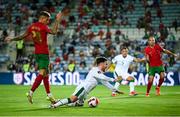 1 September 2021; Aaron Connolly of Republic of Ireland is tackled by João Cancelo of Portugal during the FIFA World Cup 2022 qualifying group A match between Portugal and Republic of Ireland at Estádio Algarve in Faro, Portugal. Photo by Stephen McCarthy/Sportsfile