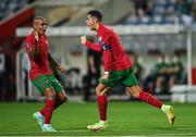 1 September 2021; Cristiano Ronaldo of Portugal, right, celebrates with team-mate João Mário after scoring their side's first goal during the FIFA World Cup 2022 qualifying group A match between Portugal and Republic of Ireland at Estádio Algarve in Faro, Portugal. Photo by Seb Daly/Sportsfile