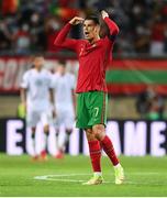 1 September 2021; Cristiano Ronaldo of Portugal encourages the supporters after scoring his side's first goal during the FIFA World Cup 2022 qualifying group A match between Portugal and Republic of Ireland at Estádio Algarve in Faro, Portugal. Photo by Stephen McCarthy/Sportsfile