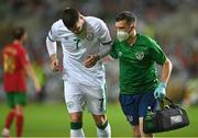 1 September 2021; Matt Doherty of Republic of Ireland and Republic of Ireland chartered physiotherapist Kevin Mulholland during the FIFA World Cup 2022 qualifying group A match between Portugal and Republic of Ireland at Estádio Algarve in Faro, Portugal. Photo by Seb Daly/Sportsfile