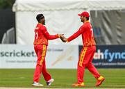 2 September 2021; Wellington Masakadza of Zimbabwe, left, and Craig Ervine celebrate the wicket of Kevin O’Brien of Ireland during match four of the Dafanews T20 series between Ireland and Zimbabwe at Bready Cricket Club in Magheramason, Tyrone. Photo by Harry Murphy/Sportsfile