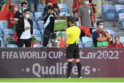 1 September 2021; Referee Matej Jug uses VAR to assist his decision to award Portugal a penalty during the FIFA World Cup 2022 qualifying group A match between Portugal and Republic of Ireland at Estádio Algarve in Faro, Portugal. Photo by Stephen McCarthy/Sportsfile