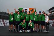3 September 2021; Eve McCrystal, bottom left, and Katie George Dunlevy of Ireland celebrate with their gold medals alongside members of Team Ireland, from left, Ireland Para-Cycling manager Dennis Toomey, Tommy McGowan, Martin Gordon, physio David Greene, head coach Neill Delahaye, Richael Timothy, Eamonn Byrne, Doctor Kate Lydon, mechanic Stephen Edwards, Ronan Grimes and Chutya Nishimatsu after winning the Women's B road race at the Fuji International Speedway on day ten during the 2020 Tokyo Summer Olympic Games in Shizuoka, Japan. Photo by David Fitzgerald/Sportsfile