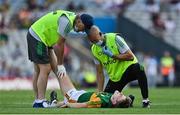 28 August 2021; Gavin White of Kerry is given medical attention by Kerry team doctor Mike Finnerty and physiotherapist Kieran O'Shea during the GAA Football All-Ireland Senior Championship semi-final match between Kerry and Tyrone at Croke Park in Dublin. Photo by Brendan Moran/Sportsfile