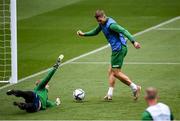 3 September 2021; James Collins in action against goalkeeper James Talbot, left, during a Republic of Ireland training session at the Aviva Stadium in Dublin. Photo by Stephen McCarthy/Sportsfile