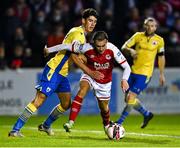 3 September 2021; Matty Smith of St Patrick's Athletic in action against Joe Manley of Longford Town during the SSE Airtricity League Premier Division match between St Patrick's Athletic and Longford Town at Richmond Park in Dublin. Photo by Eóin Noonan/Sportsfile