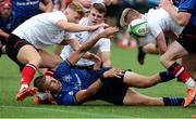 4 September 2021; Ronan Foxe of Leinster is tackled by Charlie Irvine, left, and Adam Warren of Ulster during the IRFU U19 Men's Interprovincial Championship Round 3 match between Ulster and Leinster at Newforge in Belfast. Photo by John Dickson/Sportsfile