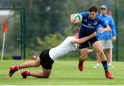 4 September 2021; Tom Hodgkinson of Leinster is tackled by Zach Scarlett of Ulster during the IRFU U18 Men's Clubs Interprovincial Championship Round 3 match between Ulster and Leinster at Newforge in Belfast. Photo by John Dickson/Sportsfile