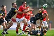 4 September 2021; Matt Gallagher of Munster Red VX is tackled by Alex Kendellen of Munster Grey XV during a challenge match between Munster XV Red and Munster XV Grey at Thomond Park in Limerick. Photo by Brendan Moran/Sportsfile