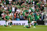 4 September 2021; Republic of Ireland players Troy Parrott, right, and Seamus Coleman take a knee before the FIFA World Cup 2022 qualifying group A match between Republic of Ireland and Azerbaijan at the Aviva Stadium in Dublin. Photo by Seb Daly/Sportsfile