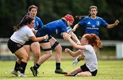 5 September 2021; Aoife Wafer of Leinster is tackled by Anna Smith, left, and Lucy Thompson of Ulster during the IRFU U18 Women's Interprovincial Championship Round 2 match between Leinster and Ulster at Templeville Road in Dublin. Photo by Ramsey Cardy/Sportsfile