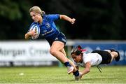 5 September 2021; Aoife Dalton of Leinster evades the tackle of Sarah Shreshta of Ulster on her way to scoring her side's seventh try during the IRFU U18 Women's Interprovincial Championship Round 2 match between Leinster and Ulster at Templeville Road in Dublin. Photo by Ramsey Cardy/Sportsfile