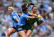 5 September 2021; Aoibhín Cleary of Meath is tackled by Niamh Collins of Dublin, supported by Carla Rowe, left, during the TG4 All-Ireland Ladies Senior Football Championship Final match between Dublin and Meath at Croke Park in Dublin. Photo by Piaras Ó Mídheach/Sportsfile
