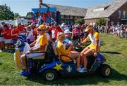 5 September 2021; Charley Hull and Emily Pedersen get a golf cart ride back to the clubhouse after losing their match in the morning foursomes on day two of the Solheim Cup at the Inverness Club in Toledo, Ohio, USA. Photo by Brian Spurlock/Sportsfile