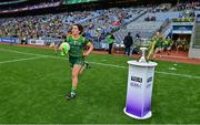 5 September 2021; Meath captain Shauna Ennis runs out past the Brendan Martin Cup before the TG4 All-Ireland Ladies Senior Football Championship Final match between Dublin and Meath at Croke Park in Dublin. Photo by Brendan Moran/Sportsfile