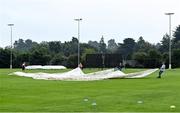6 September 2021; A general view of the pitch as the covers are removed before the one day match between Ireland Wolves and Zimbabwe XI at Belmont Park in Belfast. Photo by Piaras Ó Mídheach/Sportsfile