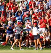 5 September 2021; Jennifer Kupcho of Team USA is congratulated by team-mate Lizette Salas after chipping the ball in on the 17th green for a birdie to win the hole during the afternoon fourballs on day two of the Solheim Cup at the Inverness Club in Toledo, Ohio, USA. Photo by Brian Spurlock/Sportsfile