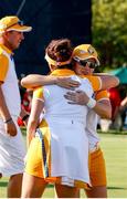 5 September 2021; Leona Maguire of Team Europe embraces team-mate Georgia Hall after halving her match with Mel Reid on the 18th green during the afternoon fourballs on day two of the Solheim Cup at the Inverness Club in Toledo, Ohio, USA. Photo by Brian Spurlock/Sportsfile