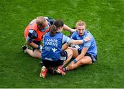 5 September 2021; Lauren Magee of Dublin is attended to by Dublin physiotherapist Sé Caffrey, left, and Dublin maor foirne Noelle Healy during the TG4 All-Ireland Ladies Senior Football Championship Final match between Dublin and Meath at Croke Park in Dublin. Photo by Stephen McCarthy/Sportsfile