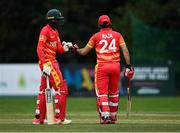 6 September 2021; Zimbabwe XI players Milton Shumba, left, and Sikandar Raza Butt during the one day match between Ireland Wolves and Zimbabwe XI at Belmont Park in Belfast. Photo by Piaras Ó Mídheach/Sportsfile