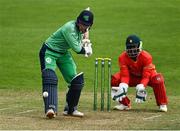 6 September 2021; Neil Rock of Ireland Wolves bats, watched by Zimbabwe XI wicketkeeper Regis Chakabva, during the one day match between Ireland Wolves and Zimbabwe XI at Belmont Park in Belfast. Photo by Piaras Ó Mídheach/Sportsfile
