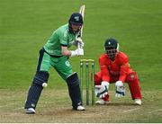 6 September 2021; Graham Kennedy of Ireland Wolves bats, watched by Zimbabwe XI wicketkeeper Regis Chakabva during the one day match between Ireland Wolves and Zimbabwe XI at Belmont Park in Belfast. Photo by Piaras Ó Mídheach/Sportsfile