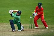 6 September 2021; Neil Rock of Ireland Wolves is caught out by the bowling of Sikandar Raza of Zimbabwe XI, as wicketkeeper Regis Chakabva looks on, during the one day match between Ireland Wolves and Zimbabwe XI at Belmont Park in Belfast. Photo by Piaras Ó Mídheach/Sportsfile