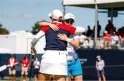 6 September 2021; Leona Maguire of Team Europe embraces Jennifer Kupcho of Team USA on the 14th green after winning her singles match on day three of the Solheim Cup at the Inverness Club in Toledo, Ohio, USA. Photo by Brian Spurlock/Sportsfile