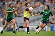 5 September 2021; Róisín Murphy of Wexford in action against Tracey Dillon, left, and Vicky Carr of Westmeath during the TG4 All-Ireland Ladies Intermediate Football Championship Final match between Westmeath and Wexford at Croke Park in Dublin. Photo by Stephen McCarthy/Sportsfile