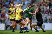 5 September 2021; Aoife Connolly of Westmeath is tackled by Wexford goalkeeper Sarah Merrigan during the TG4 All-Ireland Ladies Intermediate Football Championship Final match between Westmeath and Wexford at Croke Park in Dublin. Photo by Stephen McCarthy/Sportsfile