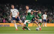 7 September 2021; Jamie McGrath of Republic of Ireland is fouled by Filip Djuricic of Serbia during the FIFA World Cup 2022 qualifying group A match between Republic of Ireland and Serbia at the Aviva Stadium in Dublin. Photo by Stephen McCarthy/Sportsfile