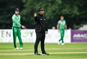 8 September 2021; Umpire Paul Reynolds signals a boundary during match one of the Dafanews International Cup ODI series between Ireland and Zimbabwe at Stormont in Belfast. Photo by Seb Daly/Sportsfile