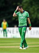 8 September 2021; Mark Adair of Ireland reacts after conceding four runs during match one of the Dafanews International Cup ODI series between Ireland and Zimbabwe at Stormont in Belfast. Photo by Seb Daly/Sportsfile