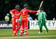 8 September 2021; Brendan Taylor of Zimbabwe, right, acknowledges the crowd after bringing up his half-century during match one of the Dafanews International Cup ODI series between Ireland and Zimbabwe at Stormont in Belfast. Photo by Seb Daly/Sportsfile