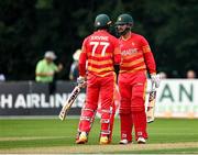 8 September 2021; Brendan Taylor of Zimbabwe, right, is congratulated by team-mate Craig Ervine, left, after bringing up his half-century during match one of the Dafanews International Cup ODI series between Ireland and Zimbabwe at Stormont in Belfast. Photo by Seb Daly/Sportsfile