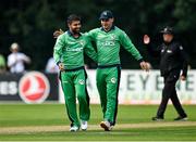 8 September 2021; Simi Singh of Ireland, left, is congratulated by team-mate Andrew McBrine after claiming the wicket of Zimbabwe's Brendan Taylor during match one of the Dafanews International Cup ODI series between Ireland and Zimbabwe at Stormont in Belfast. Photo by Seb Daly/Sportsfile