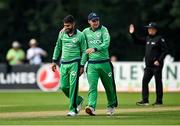 8 September 2021; Simi Singh of Ireland, left, is congratulated by team-mate Andrew McBrine after claiming the wicket of Zimbabwe's Brendan Taylor during match one of the Dafanews International Cup ODI series between Ireland and Zimbabwe at Stormont in Belfast. Photo by Seb Daly/Sportsfile