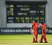 8 September 2021; Luke Jongwe, left, and Sikandar Raza of Zimbabwe during match one of the Dafanews International Cup ODI series between Ireland and Zimbabwe at Stormont in Belfast. Photo by Seb Daly/Sportsfile
