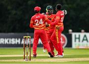8 September 2021; Wellington Masakadza of Zimbabwe, right, is congratulated by team-mates Regis Chakabva, centre, and Sikandar Raza, left, after claiming the wicket of Ireland's Paul Stirling, trapped lbw,  during match one of the Dafanews International Cup ODI series between Ireland and Zimbabwe at Stormont in Belfast. Photo by Seb Daly/Sportsfile