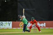 8 September 2021; Harry Tector of Ireland plays a shot, watched by Zimbabwe wicketkeeper Regis Chakabva, during match one of the Dafanews International Cup ODI series between Ireland and Zimbabwe at Stormont in Belfast. Photo by Seb Daly/Sportsfile