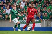 8 September 2021; Manuel Akanji of Switzerland in action against Shayne Lavery of Northern Ireland during the FIFA World Cup 2022 qualifying group C match between Northern Ireland and Switzerland at National Football Stadium at Windsor Park in Belfast. Photo by Stephen McCarthy/Sportsfile