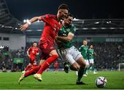 8 September 2021; Ciaron Brown of Northern Ireland in action against Andi Zeqiri of Switzerland during the FIFA World Cup 2022 qualifying group C match between Northern Ireland and Switzerland at National Football Stadium at Windsor Park in Belfast. Photo by Stephen McCarthy/Sportsfile