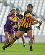 21 August 2021; Katie Power of Kilkenny in action against Linda Bolger of Wexford during the All-Ireland Senior Camogie Championship quarter-final match between Kilkenny and Wexford at Páirc Uí Chaoimh in Cork. Photo by Piaras Ó Mídheach/Sportsfile