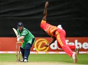 10 September 2021; Paul Stirling of Ireland receives a bowl from Luke Jongwe of Zimbabwe during match two of the Dafanews International Cup ODI series between Ireland and Zimbabwe at Stormont in Belfast. Photo by Ramsey Cardy/Sportsfile