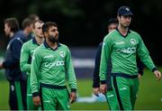 10 September 2021; Simi Singh, left, and George Dockrell of Ireland following the abandonment of match two of the Dafanews International Cup ODI series between Ireland and Zimbabwe at Stormont in Belfast. Photo by Ramsey Cardy/Sportsfile