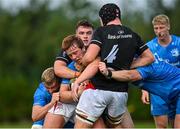 11 September 2021; Donough Lawlor of Leinster is tackled by James McCormick, left, and Charlie Irvine of Ulster during the Development Interprovincial match between Leinster XV and Ulster XV at the IRFU High Performance Centre, on the Sport Ireland Campus in Dublin. Photo by Seb Daly/Sportsfile