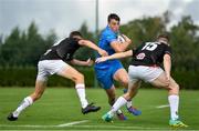 11 September 2021; Charlie Tector of Leinster is tackled by James Humphreys, left, and Shea O’Brien of Ulster during the Development Interprovincial match between Leinster XV and Ulster XV at the IRFU High Performance Centre, on the Sport Ireland Campus in Dublin. Photo by Seb Daly/Sportsfile