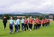 11 September 2021; Players of both sides fist bump after the Clear Currency Women's All-Ireland T20 Cup Semi-Final match between Bready and CSNI at Bready Cricket Club in Tyrone. Photo by Ben McShane/Sportsfile