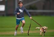 11 September 2021; A young supporter retreives his dog, who invaded the field of play, during the Clear Currency Women's All-Ireland T20 Cup Semi-Final match between Bready and CSNI at Bready Cricket Club in Tyrone. Photo by Ben McShane/Sportsfile